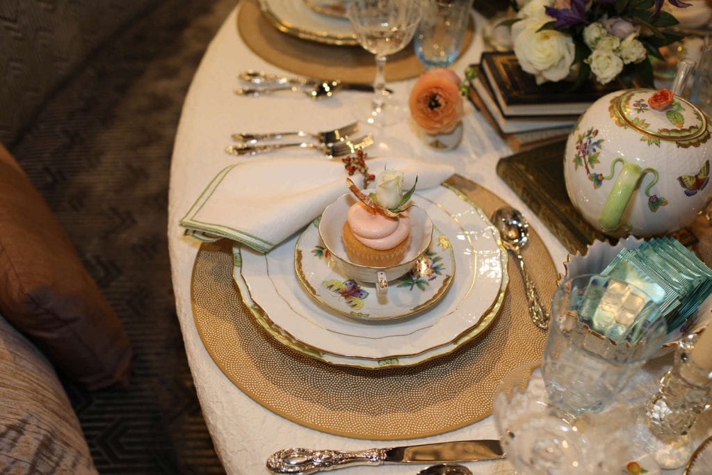 holiday table setting with gold rimmed plates