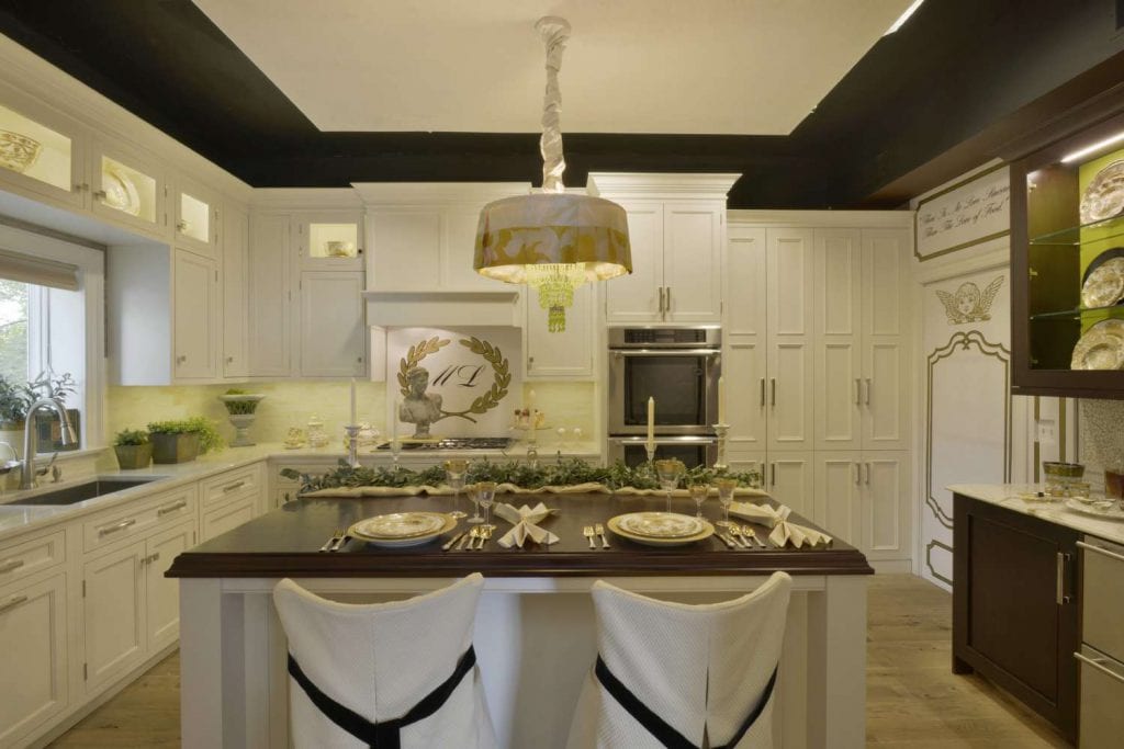 French themed kitchen design by Maria LoIacono with table garland and slip covered bar stools.