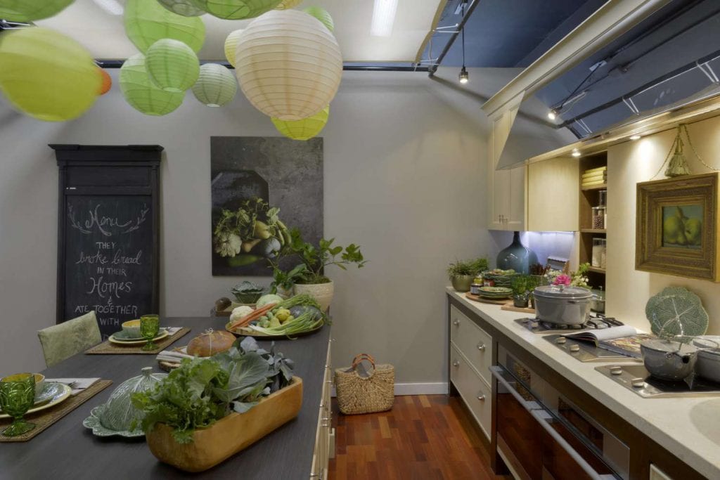 Playful kitchen features chalkboard and colorful paper lanterns