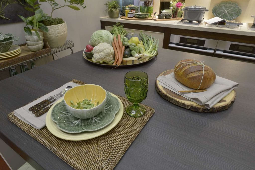 vintage “Cabbage Green” tableware with fresh vegetable platter.