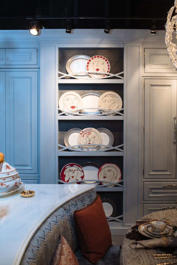 china displayed in a kitchen with custom blue cabinetry