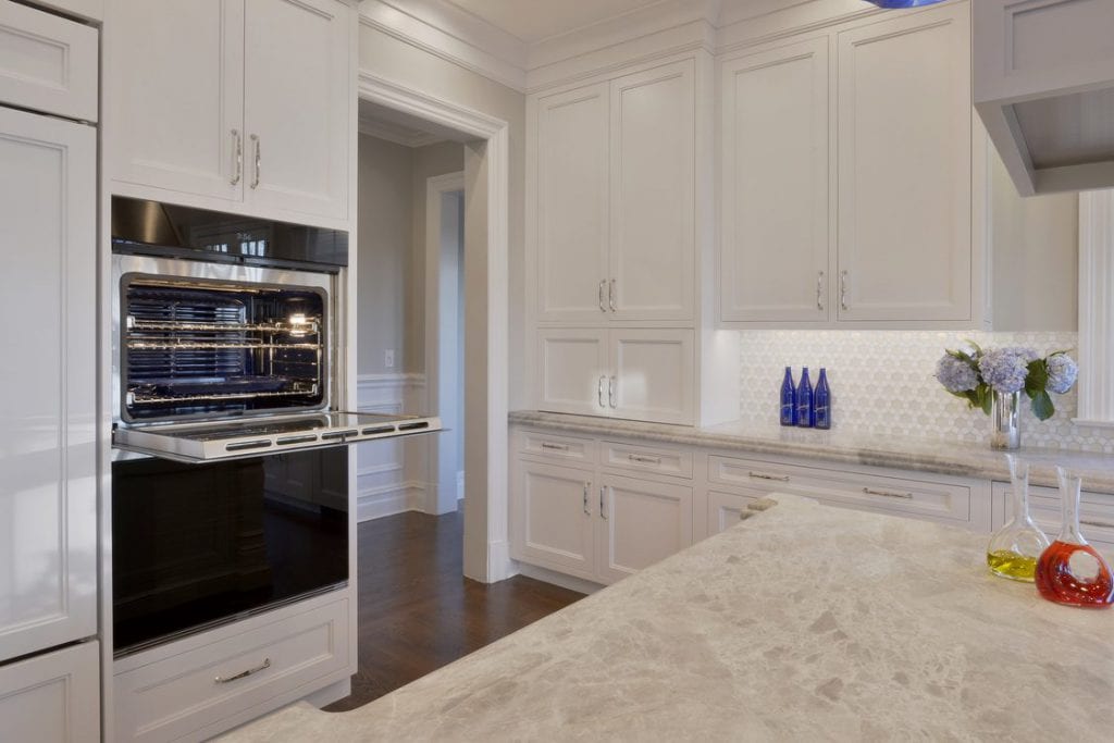 Double wall ovens in a classic white kitchen.