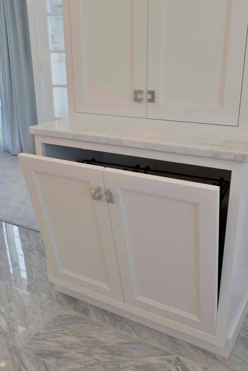 Luxury bathroom features Bilotta custom cabinetry in Super White.