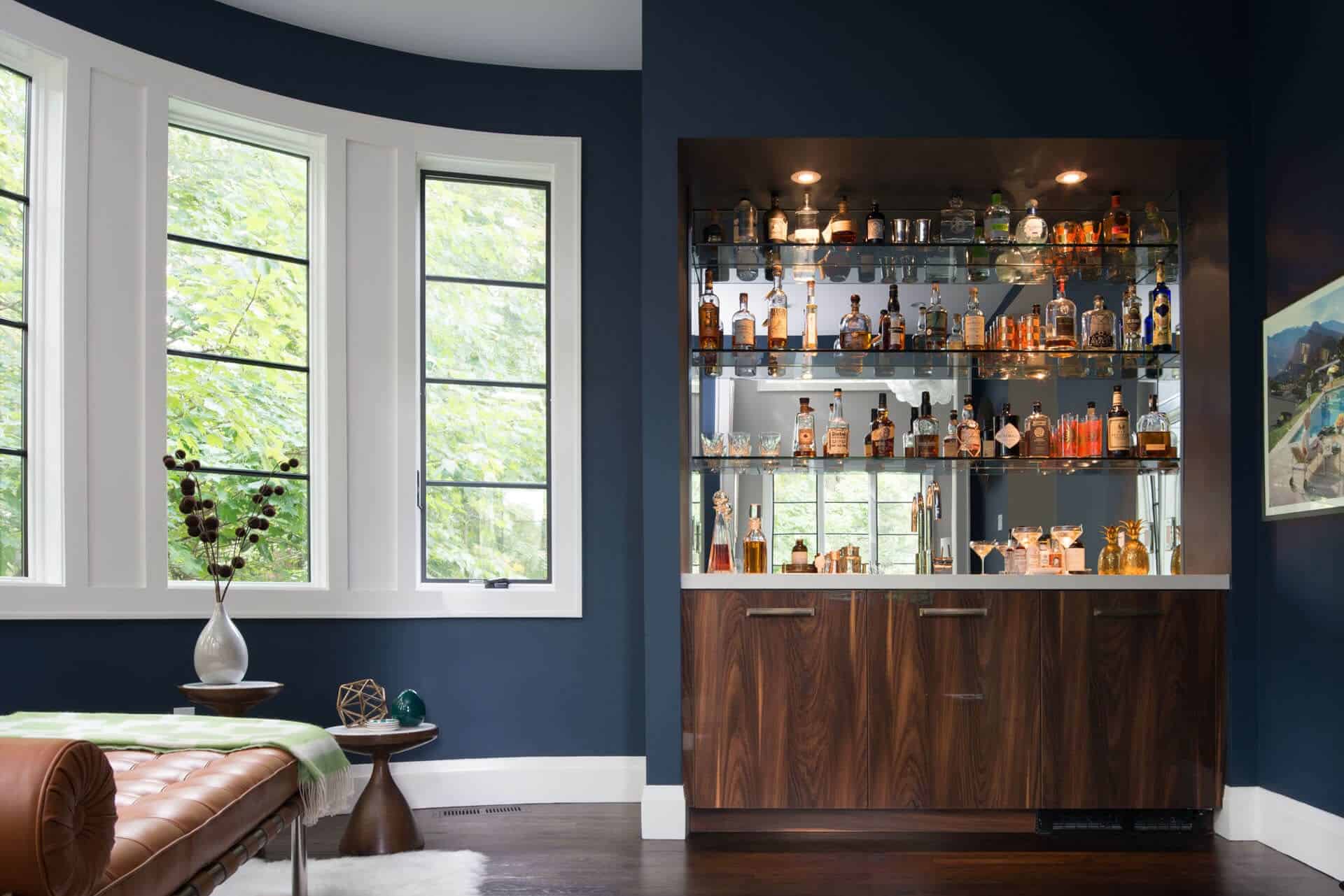 Natural walnut Bilotta custom mid-century modern bar with mirrored backsplash.