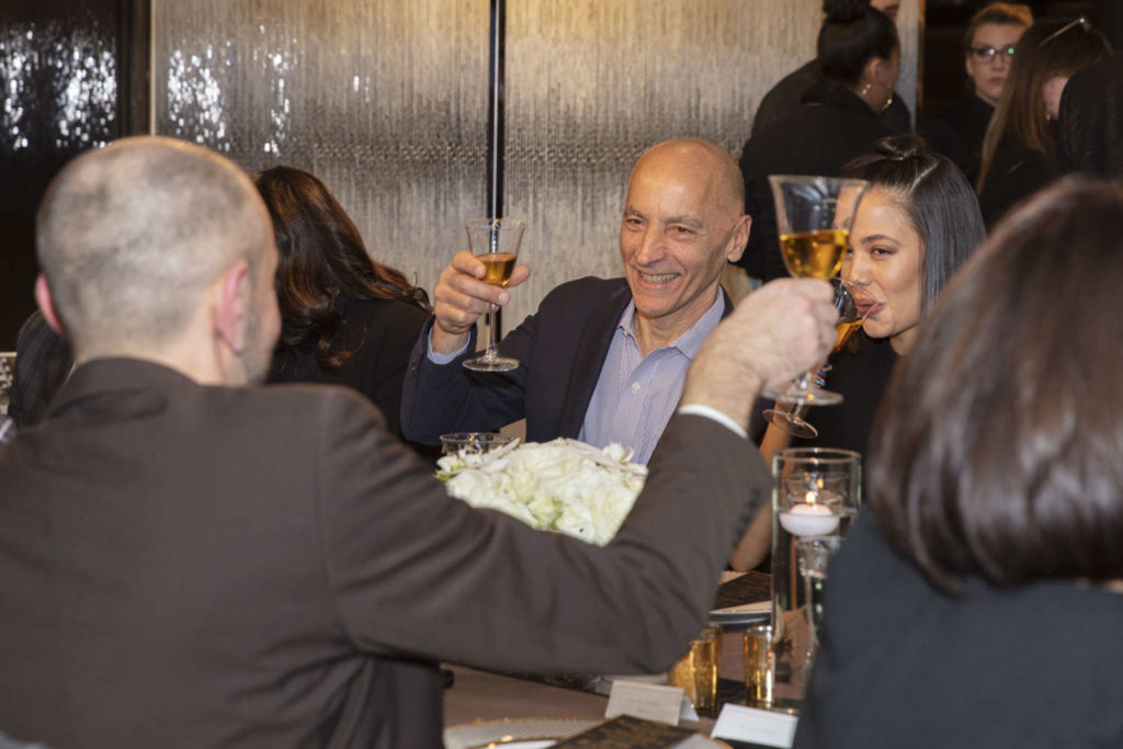 Jim Bilotta and guests raising a glass at the truffle dinner