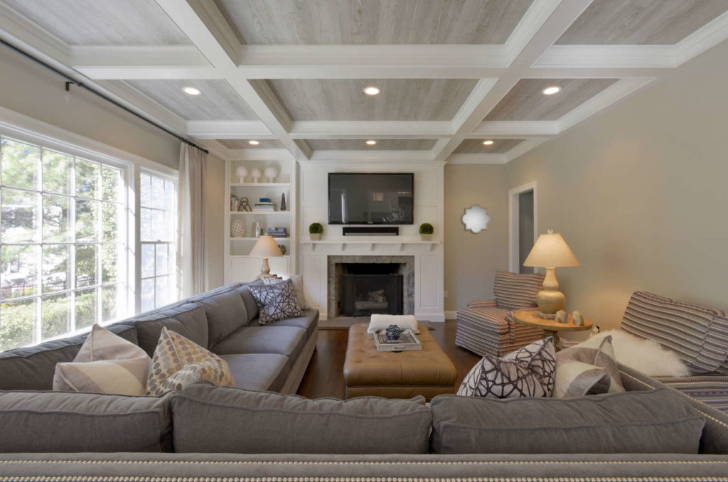 Living Room with Coffered Ceiling and wood pattered wallpaper