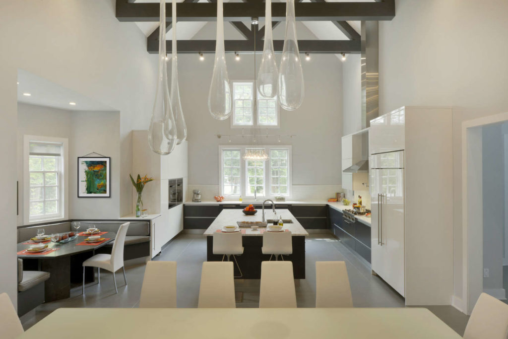 Contemporary Kitchen with soaring vaulted ceiling, exposed beams and teardrop pendants