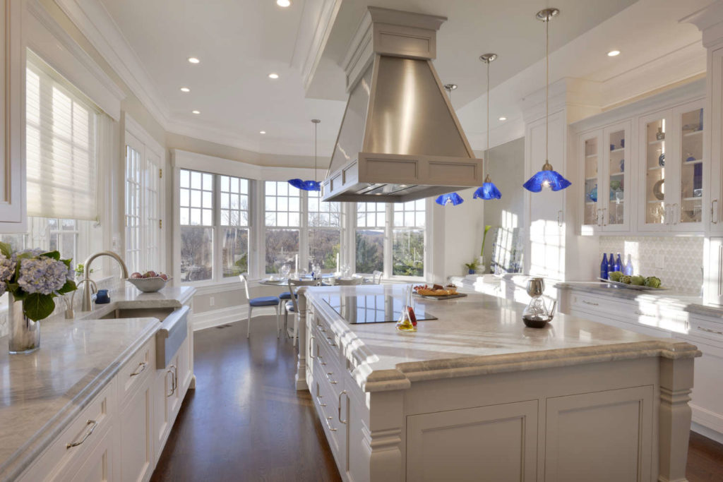 Traditional White Kitchen with stepped ceiling and blue pendant lights