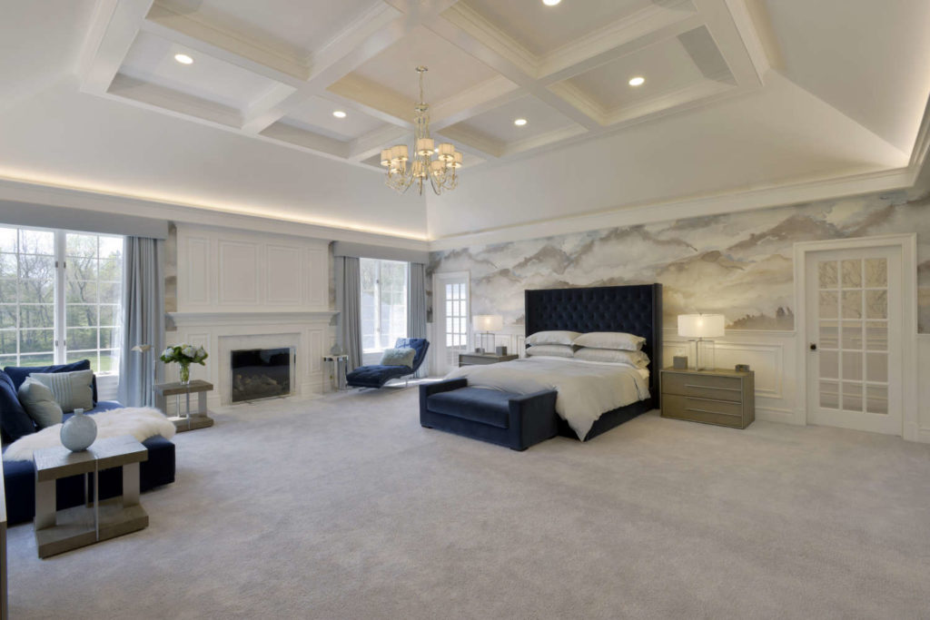 Bedroom with sloped tray ceiling
