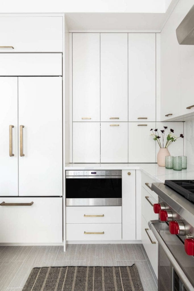Tribeca loft kitchen features island with waterfall Silestone countertop and Bilotta frameless Copenhagen cabinetry.