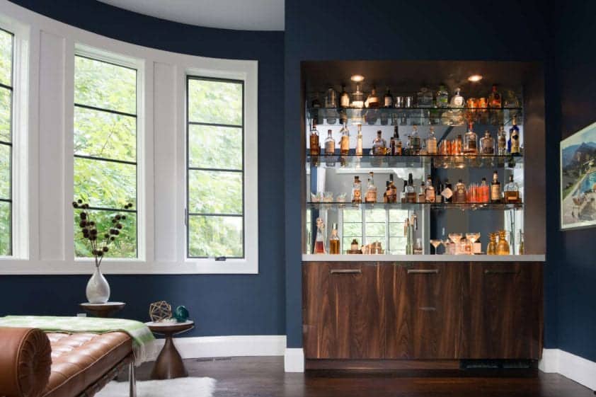 Mid-century modern bar features ‐ Yosemite Bronzato Verticle Grain with gloss finish, quartz countertop and glass open shelving