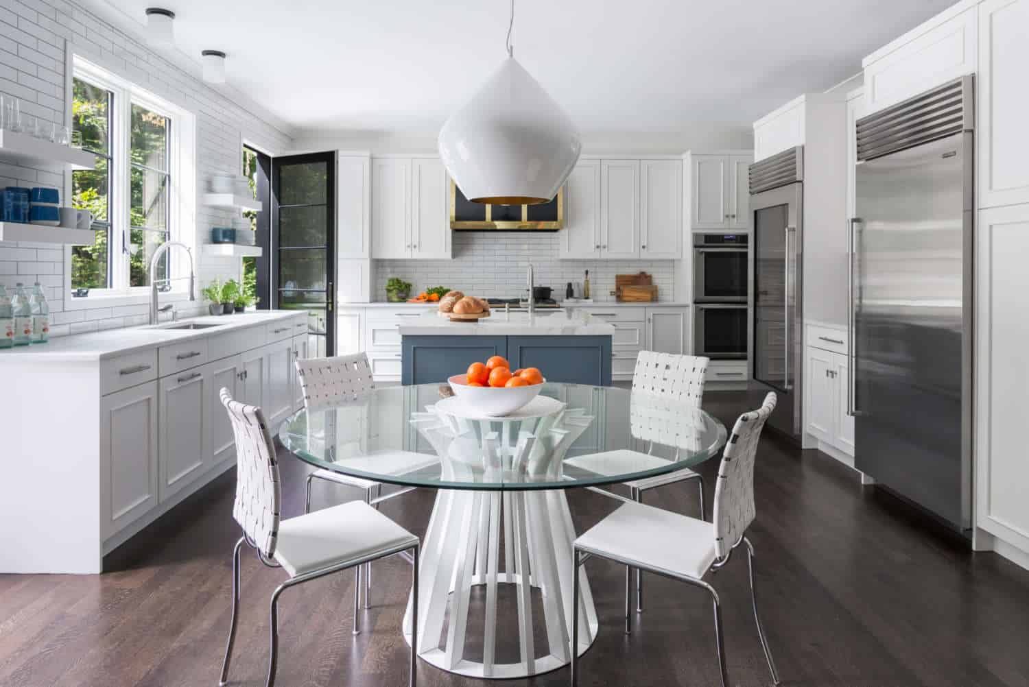 Classic all white Chappaqua kitchen features Bilotta recessed panel cabinets accented by a Blue Toile painted center island.