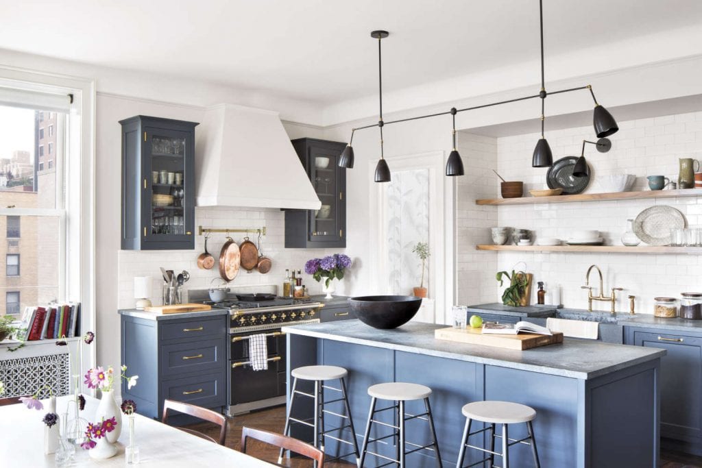 Blue NYC Loft Kitchen features a black Lacanche “Chagny” range.