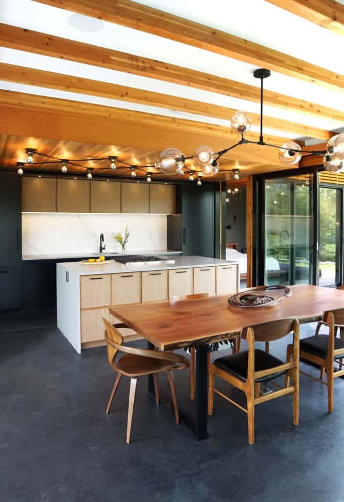Walnut Kitchen in Hudson New York features exposed beams and custom lighting