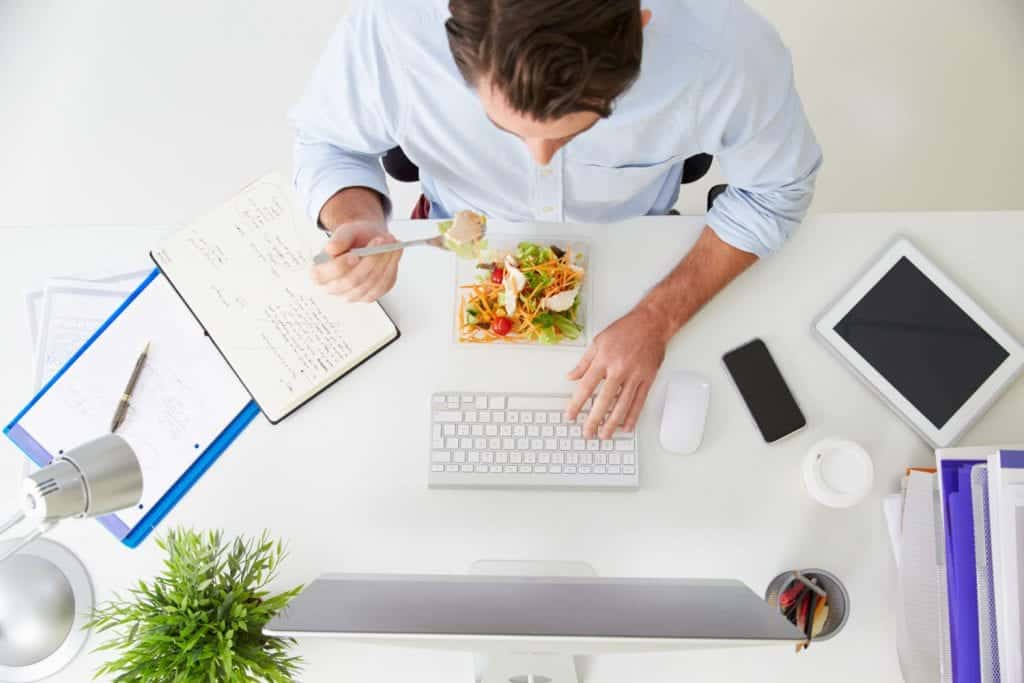 Person Eating Lunch & Checking Email