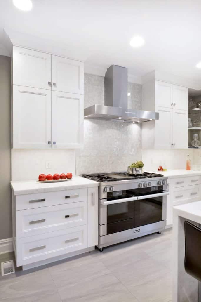 Transitional White Kitchen with Miele dual fuel “smart” range.