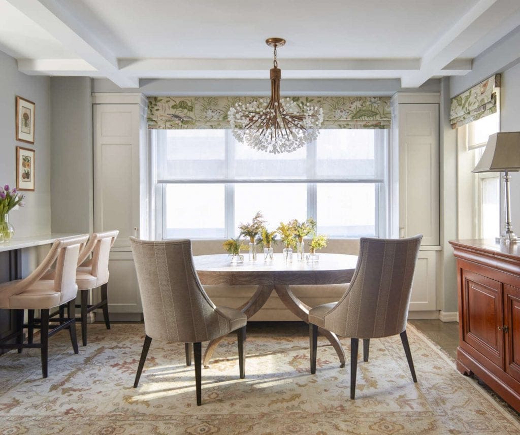 Dining Room with brass tree-inspired light fixture.