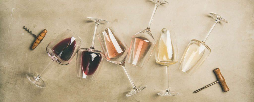 Glasses filled with red wine, Rose and white wine.