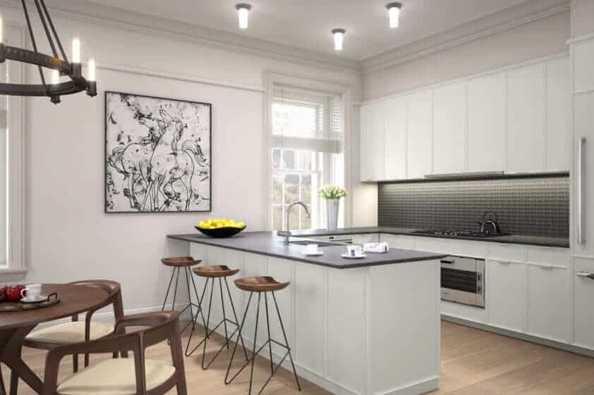 Multi-unit residential brownstone condo kitchen features white Rutt Prairie Collection cabinetry and slate countertops.