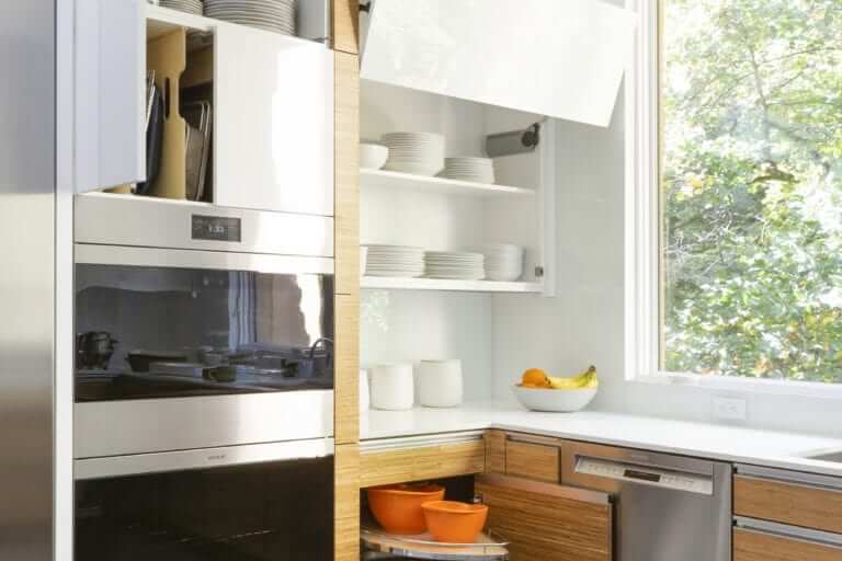 Clean modern kitchen features NAC cabinets with ample concealed storage.