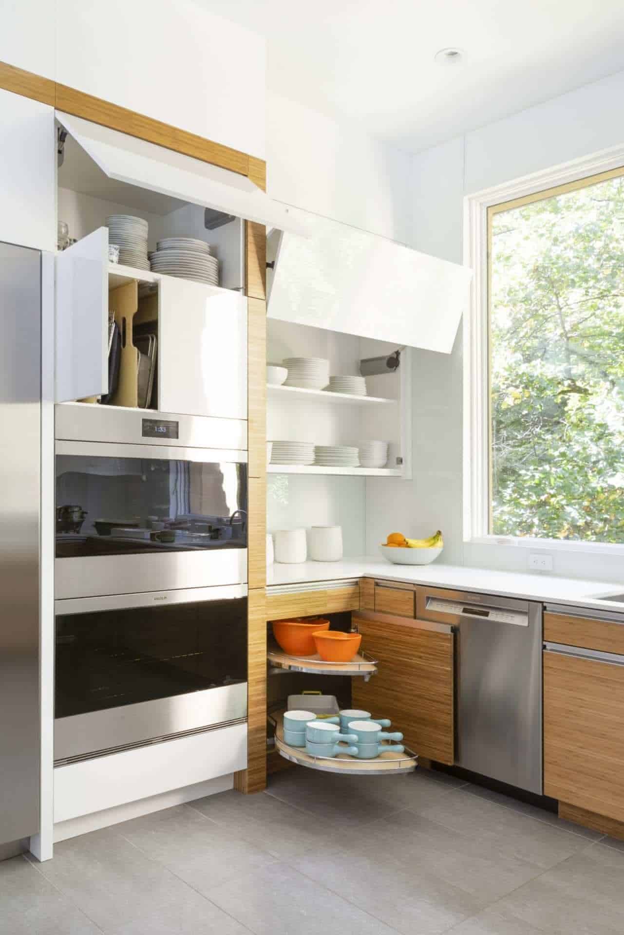 Clean modern kitchen features NAC cabinets with ample concealed storage.