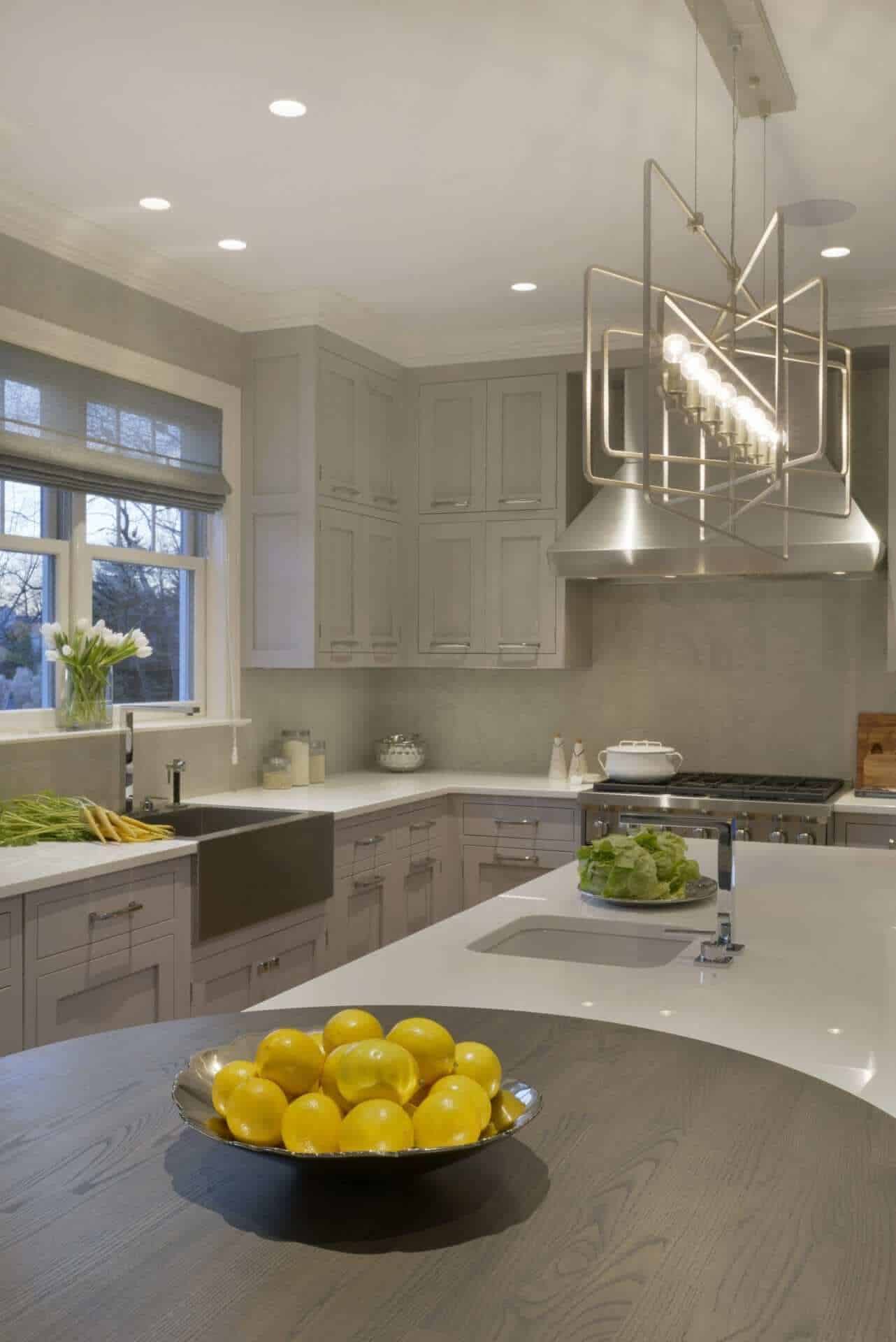 U-shaped kitchen features rift cut white ash Bilotta cabinets with Smoke Embers finish