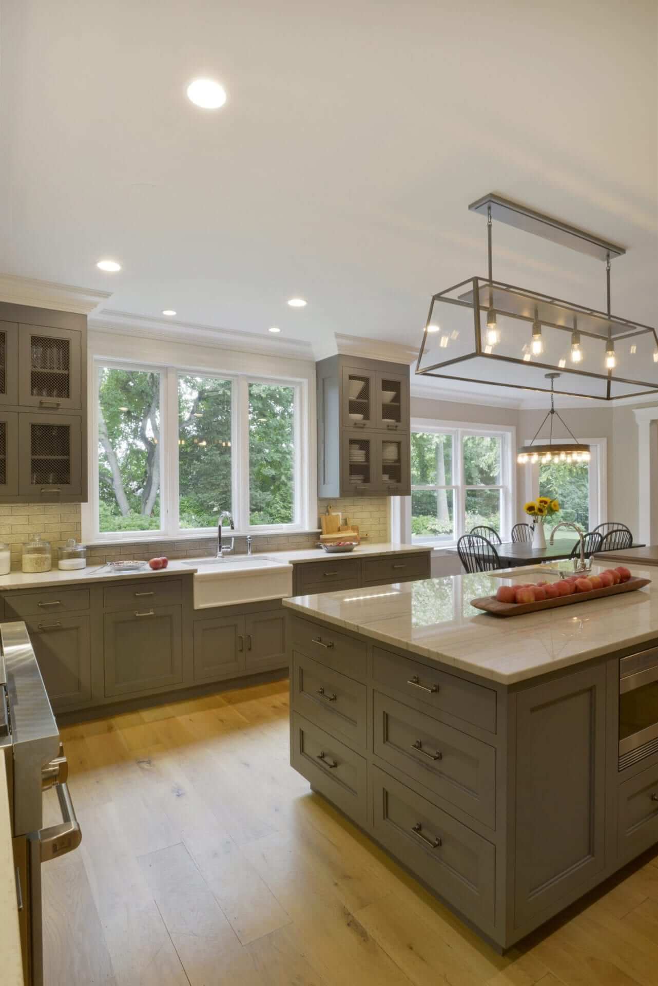 White Macambas Caesarstone topped grey Bilotta island is central in this Country kitchen