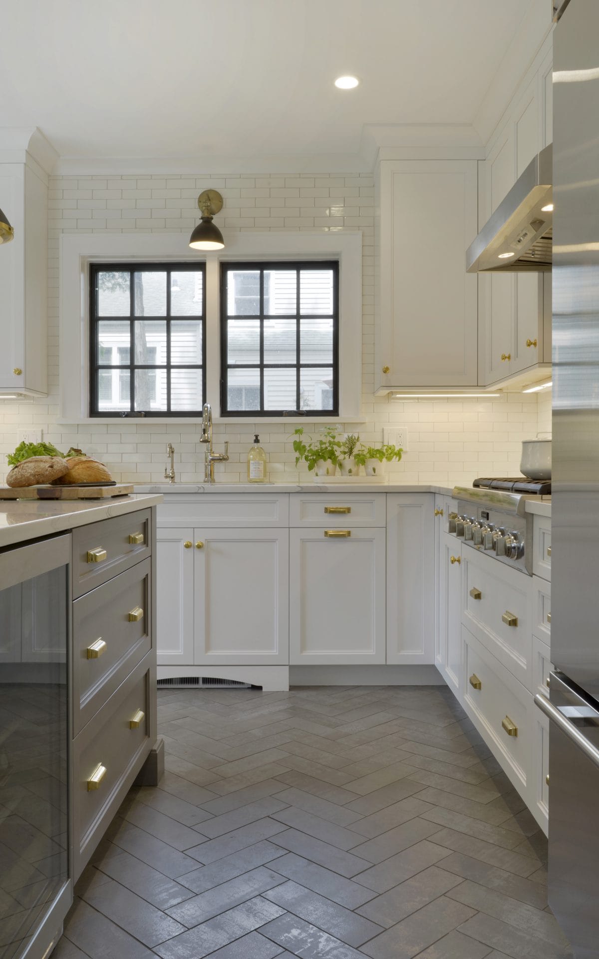 Classic White & Grey Kitchen with Herringbone floor and Black Window Frames.
