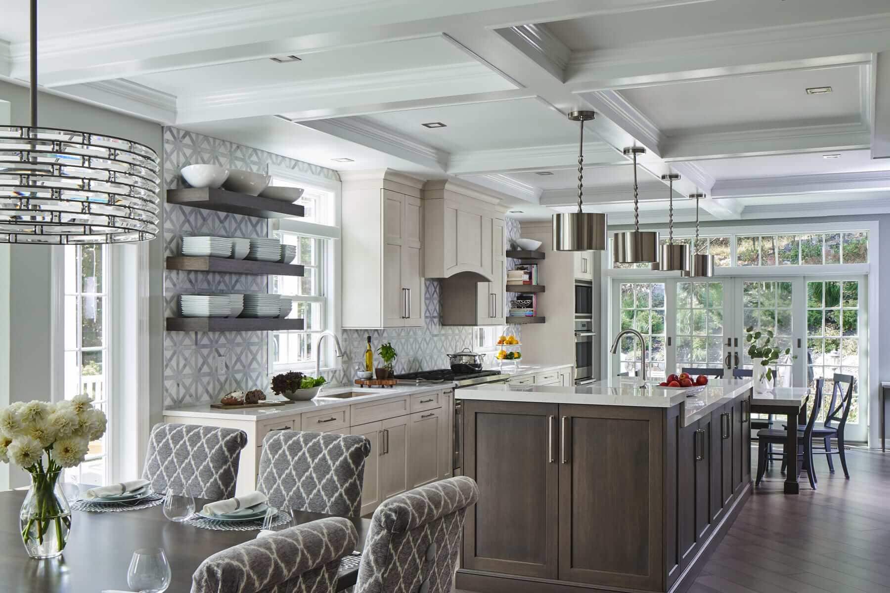 Elegant kitchen with large eat-at island in Benjamin Moore's Vale Mist.