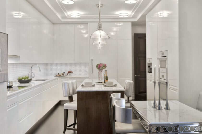 Luminous kitchen features Xven Wenge High Gloss Lacquer with white opal stone countertop and Artcraft white high gloss white cabinetry.