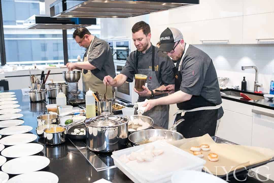 Chefs preparing food for Dine & Design on 9 event