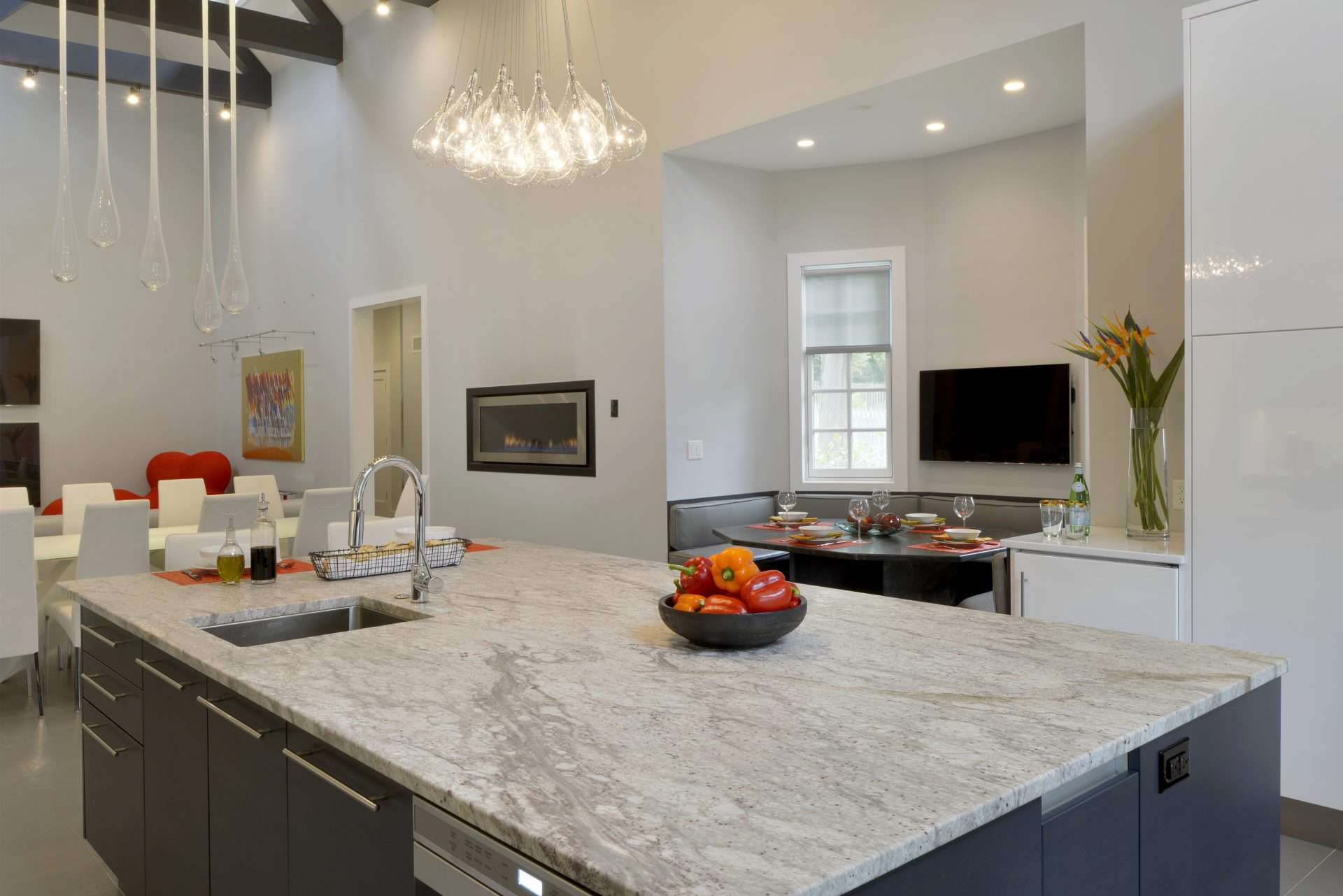 Marble topped center island  of Chester NJ contemporary kitchen features alumasteel accents and toe kick.