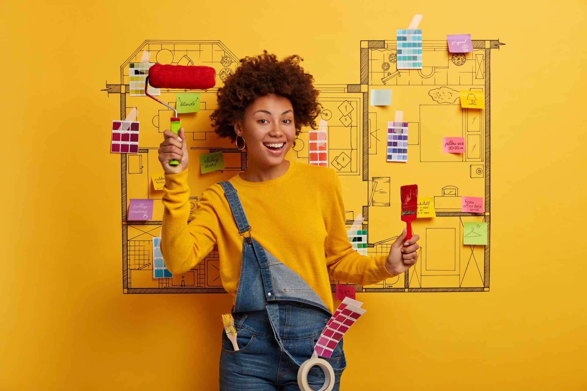 Woman with Blueprint of House with Paint Swatches