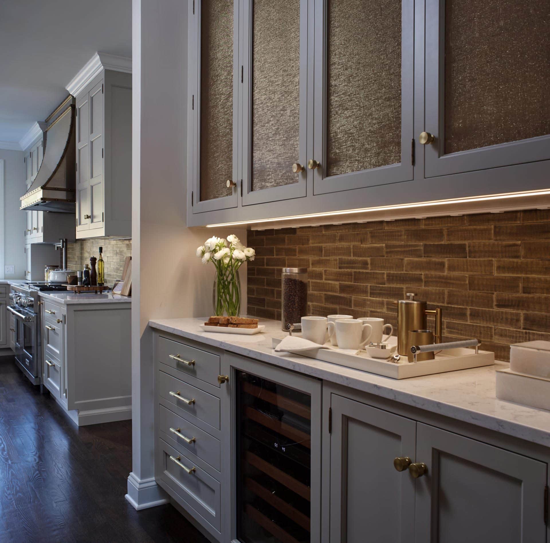 Taupe Butler's Pantry with Shimmery Inserts for the Wall Cabinets and Bronze Brick Backsplash