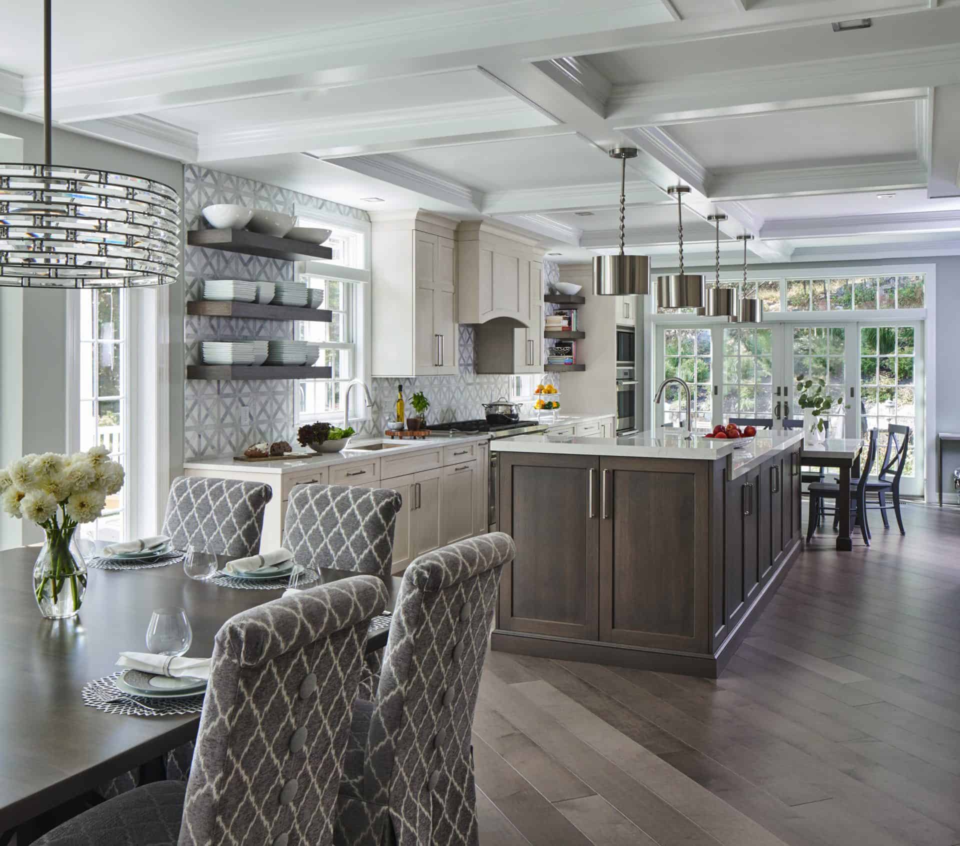 Classic White Kitchen with Grey Island and Fabric Covered Dining Chairs