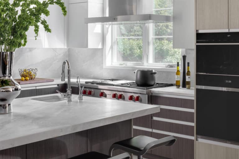 Modern kitchen with textured laminate, high gloss and white Artcraft cabinets.