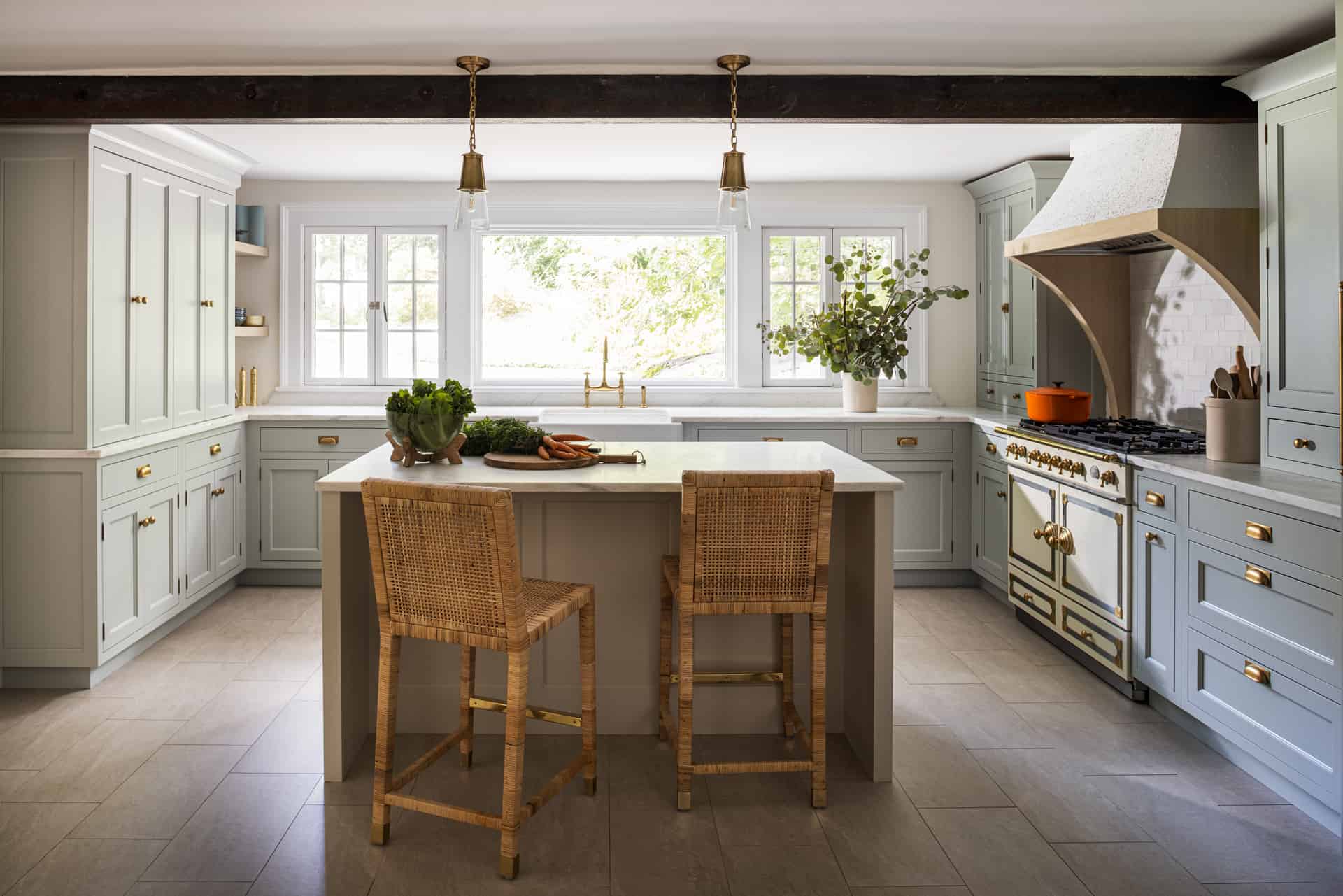 Traditional coffered ceiling kitchen mixes rift cut oak island with portobello stain and soft white glazed cabinets.