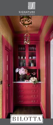 vertical banner showing Signature Custom Cabinetry and Bilotta logos with a photo of a hallway with small red built-in cabinet and drawers at the end, red doors, and red crown moulding and baseboards