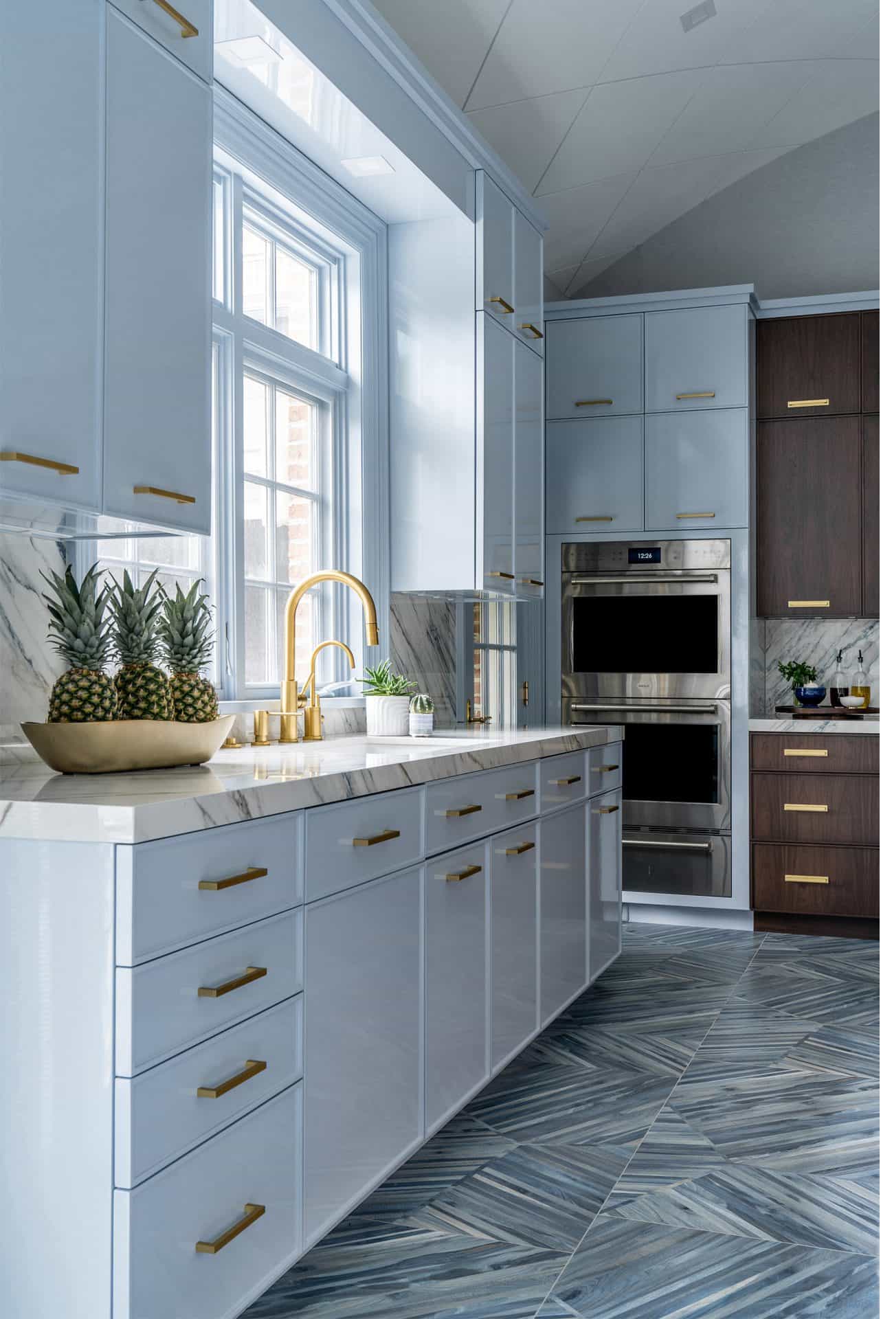 Blue Kitchen with White Hood and Brass Trim - Transitional - Kitchen