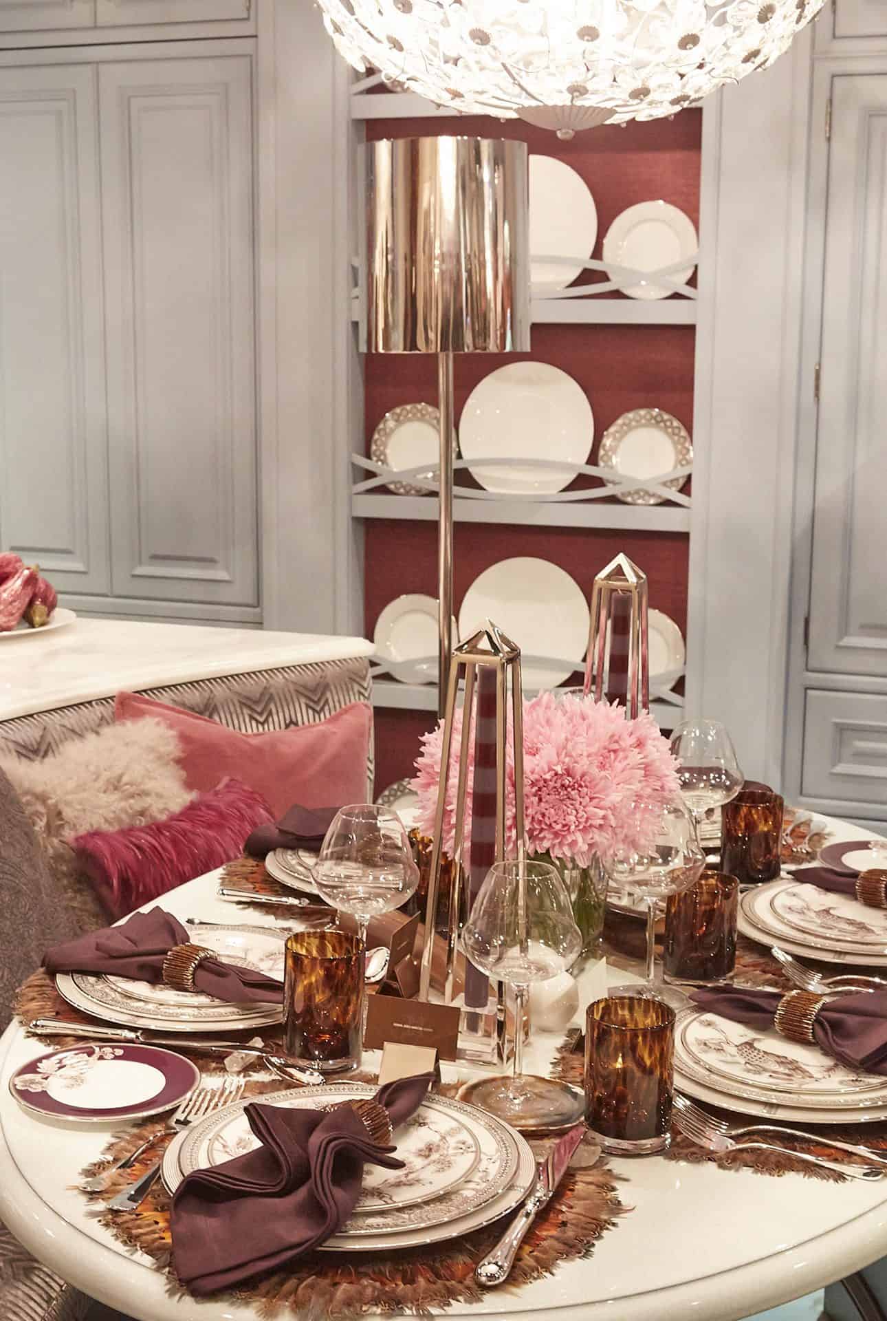 Tabletop design using pinks, and wine tones with Fine Bone China and silverware place settings.