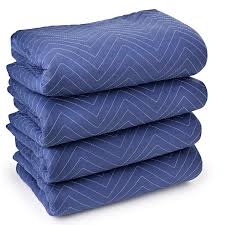 Stack of four blue wrapping blankets